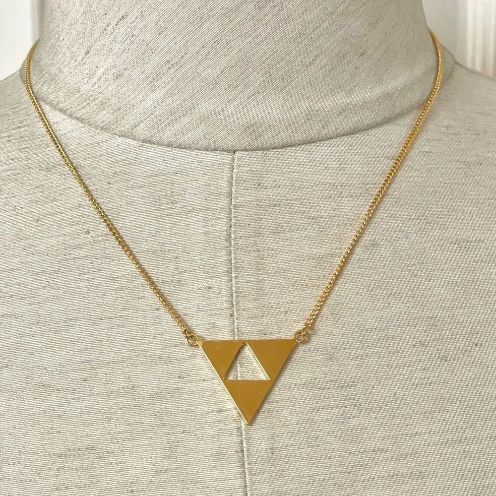 Trina Turk gold tone cut out triangle pendant necklace
